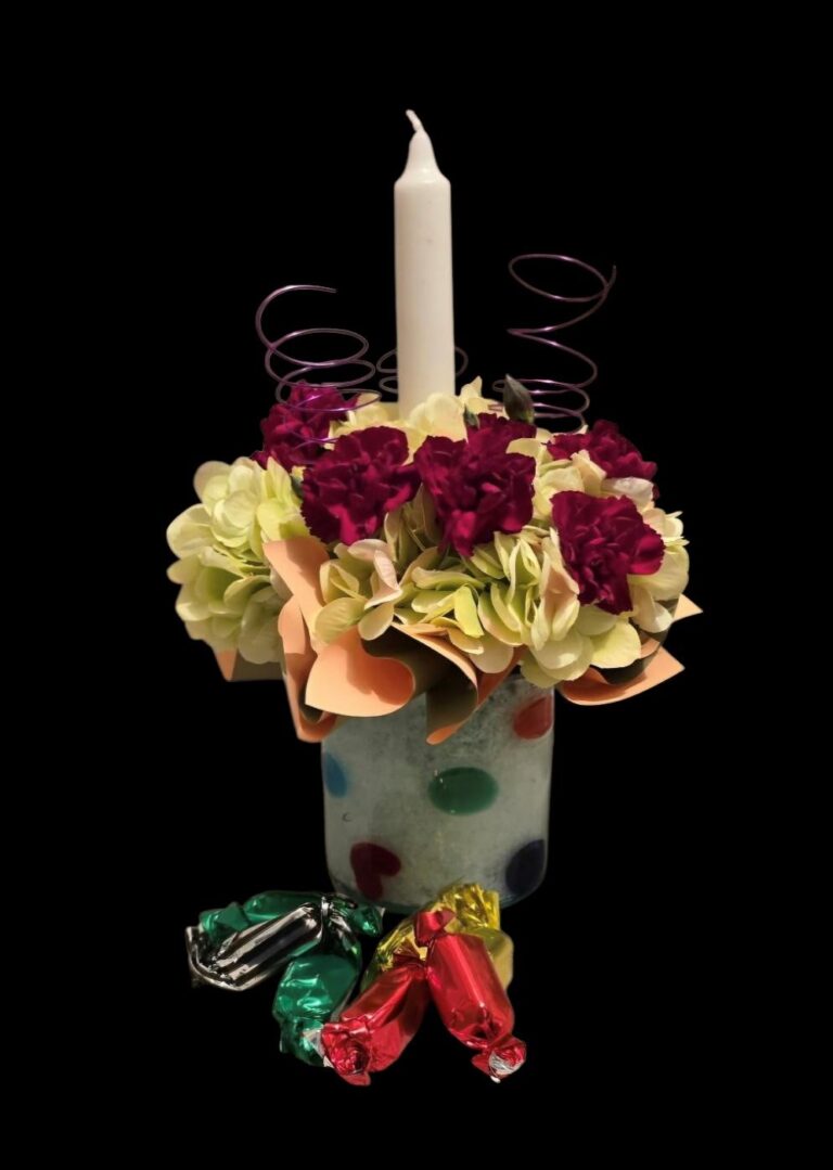 Affordable Birthday flowers under $50 with local delivery to Jefferson, Glidden, IA, Scranton and other nearby areas. Flowers, candle and sweet treats!