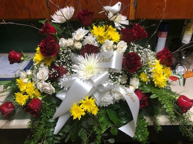 In God’s Hands Casket Arrangement