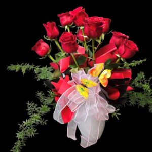 10 Premium Ruby Red Roses in a designer vase create an unforgettable expression of love.